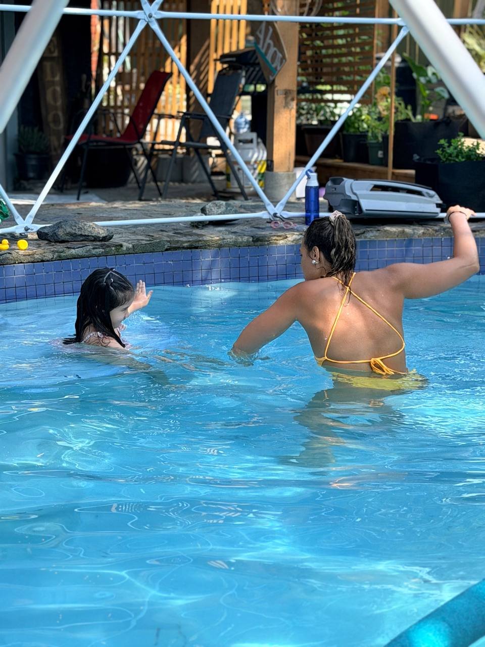 High five in the pool after a lesson